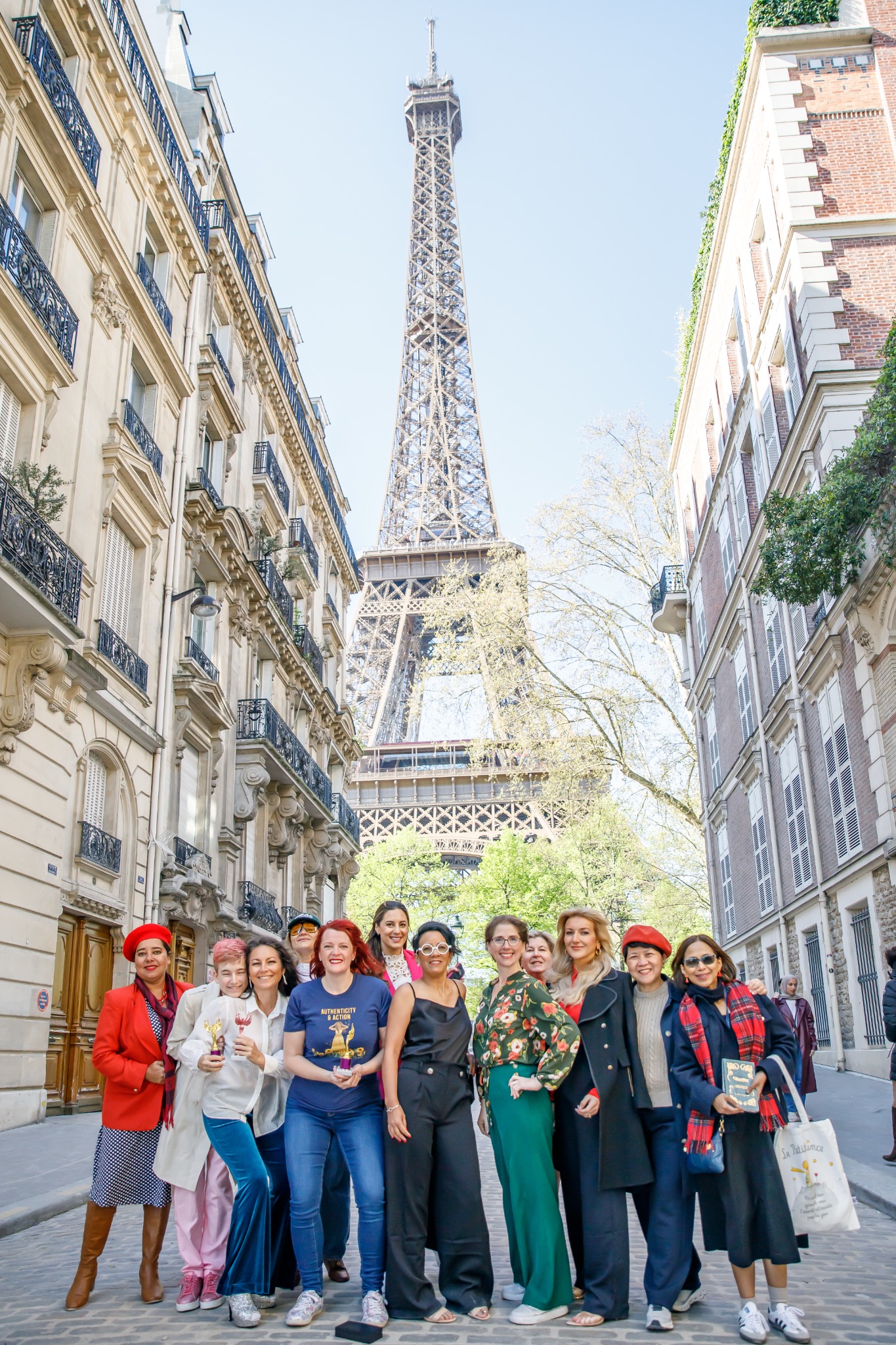 Tanya Hicks with a group gathered beneath the Eiffel Tower