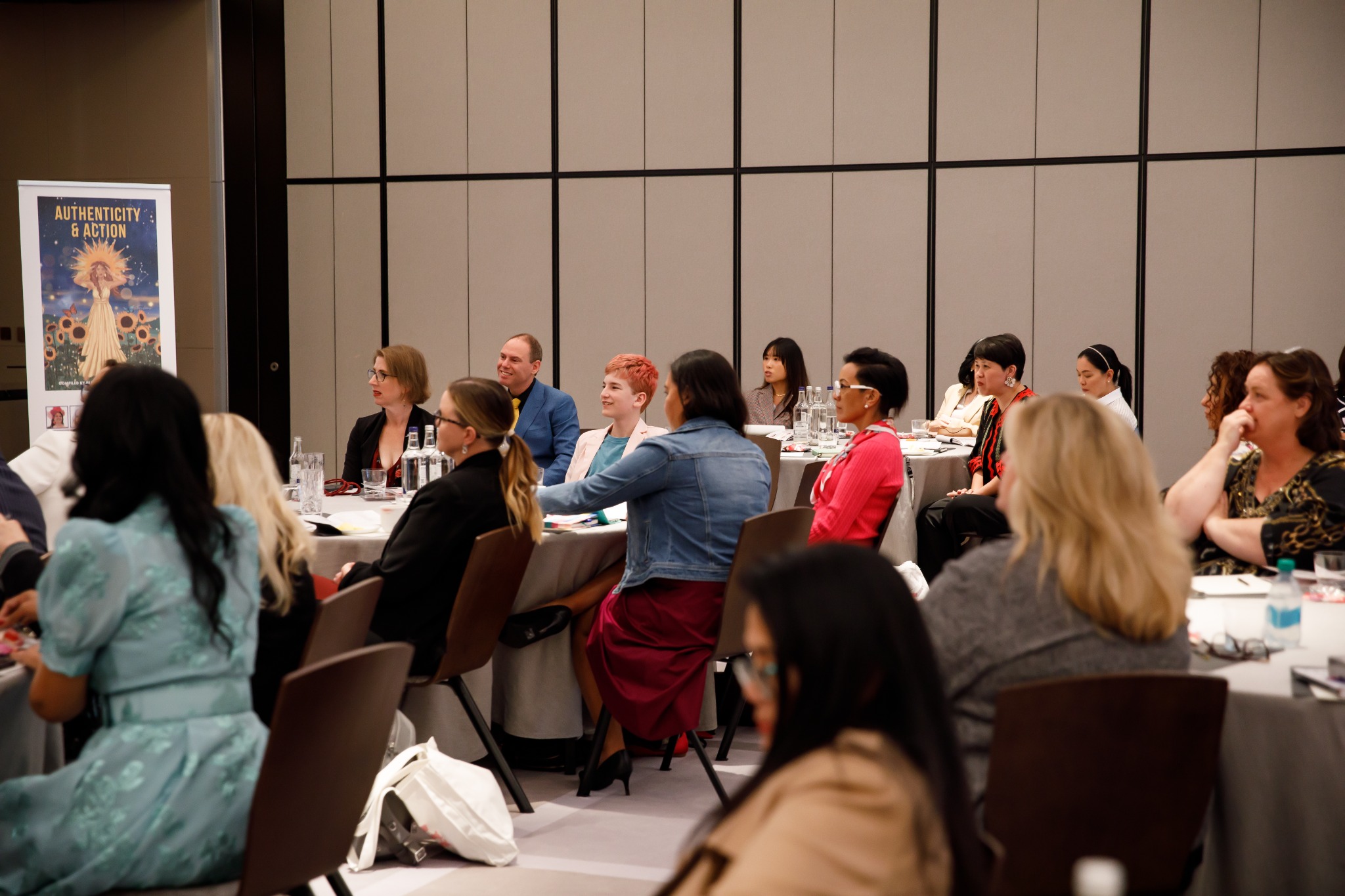 Audience members listening during the Women Changing the World event